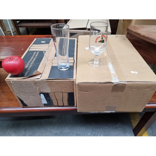 492 - Two boxes of glasses including Orchard Thieves half pint glasses and Birra Moretti glasses