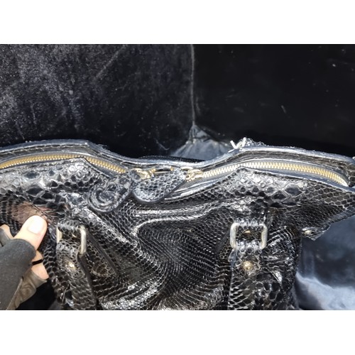 529 - Zagliani’s popular Puffy handbag is made from beautiful black python that is simply accented with go... 