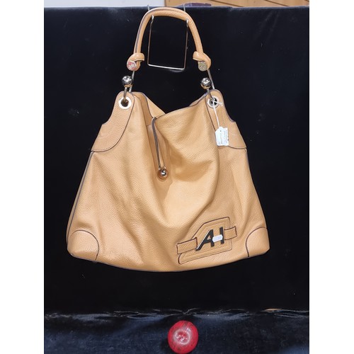 530 - Star Lot : A super stylish genuine caramel leather shoulder bag by Anya Hindmarch. Similar pieces ar... 