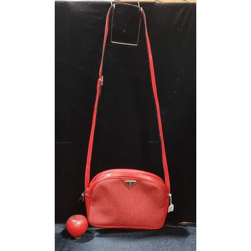 532 - A classic ladies genuine Yves Saint Laurent red leather shoulder bag featuring woven detailing to bo... 