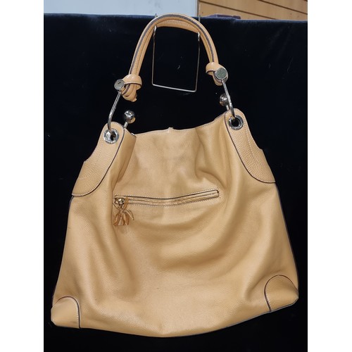 530 - Star Lot : A super stylish genuine caramel leather shoulder bag by Anya Hindmarch. Similar pieces ar... 