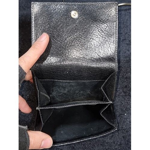 527 - Star Lot : A 2000s Gucci interlocking logo black Tri-Folder Italian leather wallet. Features compart... 