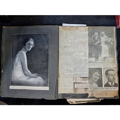 249 - Star Lot :An antique album Full of Irish newspaper cuttings and obituaries and prayer cards from the... 