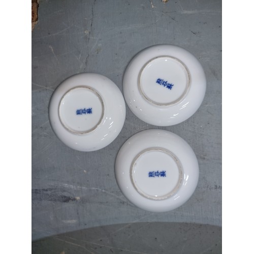 497 - A trio of antique Chinese blue and white pin dishes.