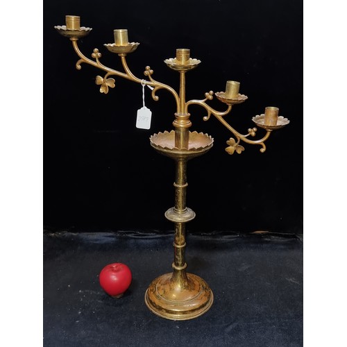 469 - A tall heavy antique brass ecclesiastical candelabra / candlestick with shamrock accents.