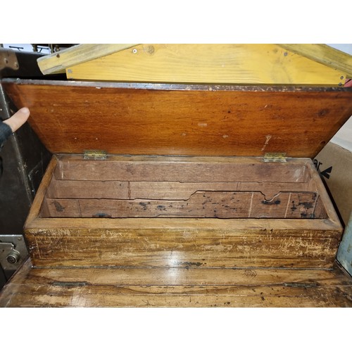 872 - Star Lot: A 19th century desk top writing slope with tooled leather top and two compartments that li... 