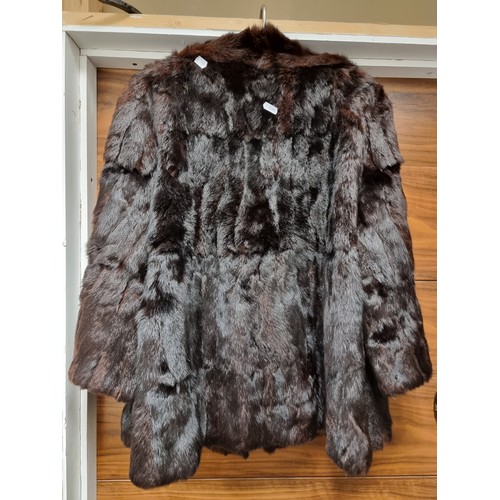 842 - A lovely genuine mink fur jacket with flowy sleeves and two front pockets. In very good condition.