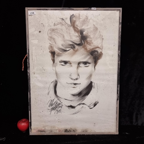 104 - A striking original chalk and charcoal on paper artwork dating to 1986, featuring a portrait en face... 