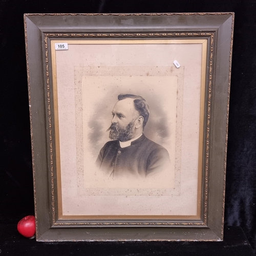 105 - A large antique black and white photograph of a finely dressed gentleman in profile, likely dating t... 