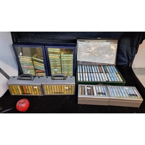 134 - A huge collection of vintage cassette tapes in 7 carry cases. Includes tapes from artists such as Fl... 