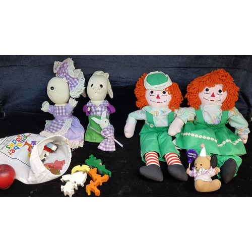 148 - A charming collection of children's toys. Including a wonderful pair of red headed rag dolls, a rabb... 