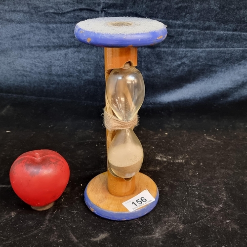 156 - A charming vintage unusual hourglass sand timer mounted on wooden bobbin.