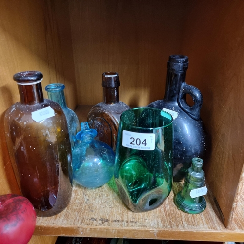 204 - Seven gorgeous pieces of colourful studio glass and bottles in shades of emerald green, cobalt blue,... 