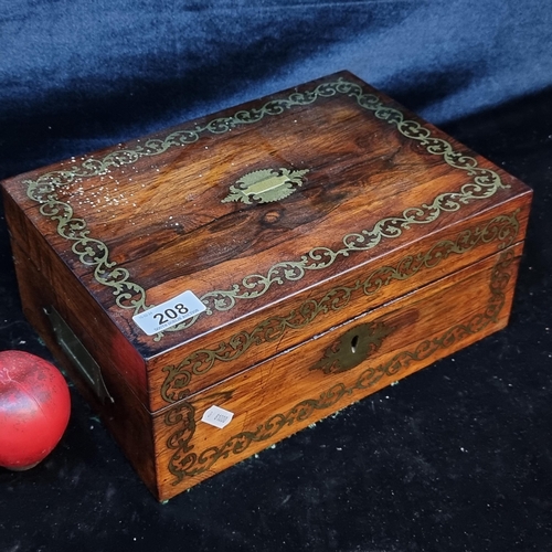 208 - A rather handsome antique mahogany box featuring brass hardware along with brass floral scroll detai... 