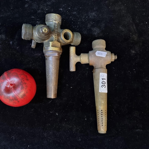 211 - Two fabulous and heavy vintage solid brass beer barrel taps, one branded Briteal.