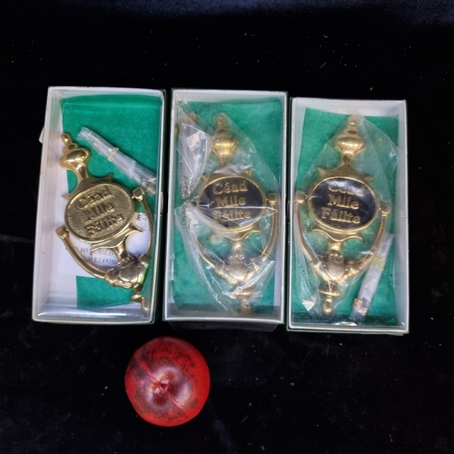 212 - Three brand new in box solid brass doorknockers reading 'Cead Míle Fáilte'.