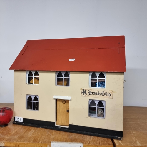 221 - A beautifully handcrafted full dolls house containing an adorable, large quantity of furniture and h... 