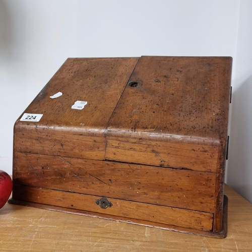 224 - A handsome antique 19th century desk top stationary cupboard in oak opens to reveal dividers and two... 