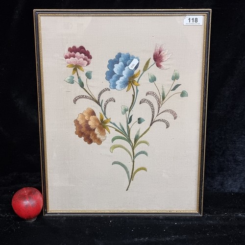 118 - A gorgeous late 19th century satin stitch embroidery of still life flowers. Housed in a black and gi... 