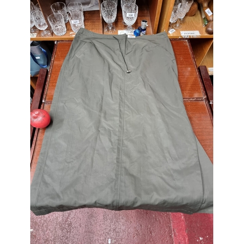 281 - A gorgeous ladies skirt by Ramsey Dublin in a khaki green. Size UK 16. New With no tags