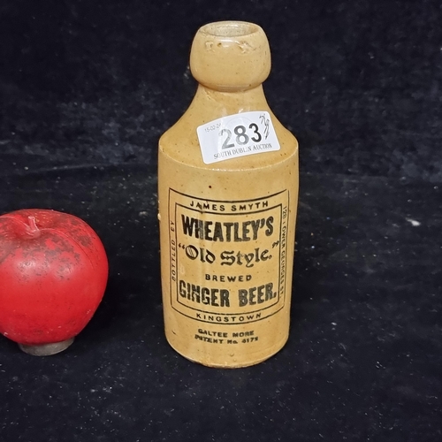 283 - An excellent rare example of an antique stoneware ginger beer bottle for Wheatley's of Kingstown, pr... 