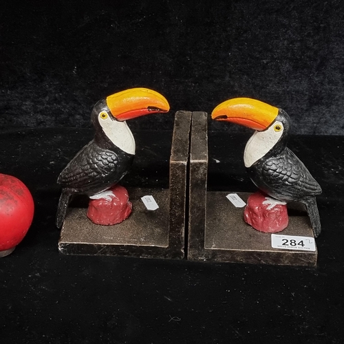 284 - A charming pair of very heavy cast metal Guinness toucan bookends.