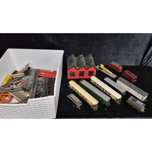 290 - A box containing a large selection of vintage Tri-ang model train items including five carriages, se... 