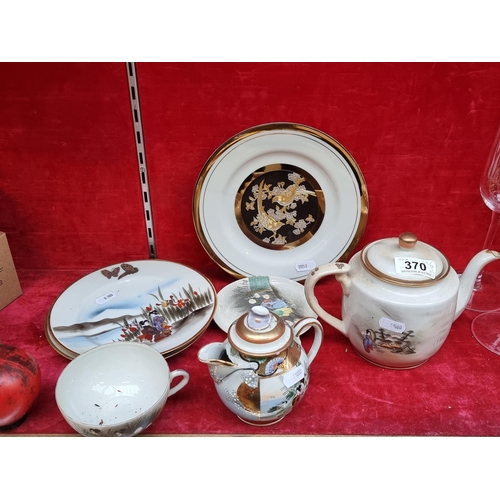 370 - A collection of Japanese porcelain items including hand painted plates, a teacup and 2 teapots with ... 