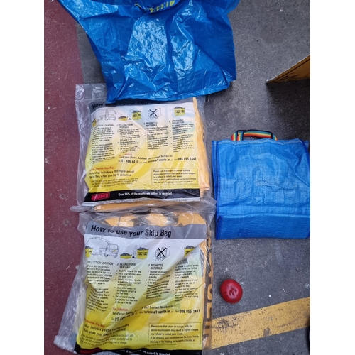 378 - Two A1 Recycling 4U 1 1/4 tonne skip bags. Unopened in original packaging. A tarp and a waterproof b... 