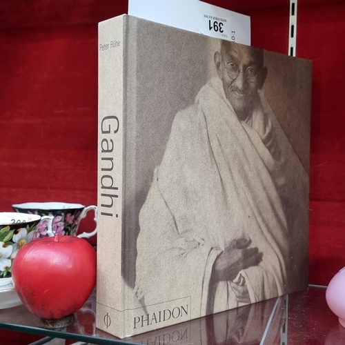 391 - A large hardback  book copy of 'Gandhi: A Photo Biography
Peter Rühe' published by Phaidon. Full of ... 