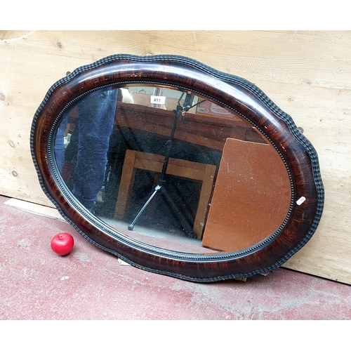 411 - A very nice antique oval wall mirror.
H67cm W90cm