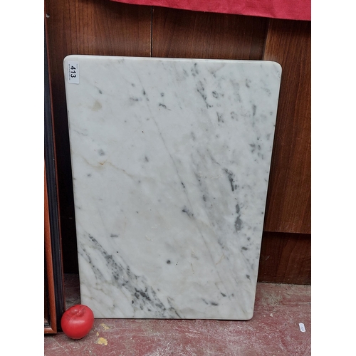 413 - A quality speckled marble large cutting board from a large home in Dalkey.. L62cm X H41cm. Heavy.