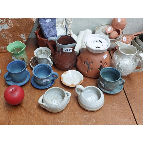 423 - Fifteen gorgeous pieces of handmade art studio pottery including abstract cups, saucers and jugs.