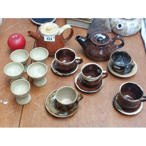 424 - Seventeen beautiful pieces of handmade art studio pottery including a fabulous two tone teapot, a sm... 