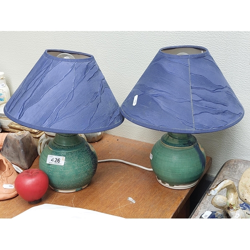 426 - Two beautiful ceramic emerald green table lamps featuring cobalt blue shades.