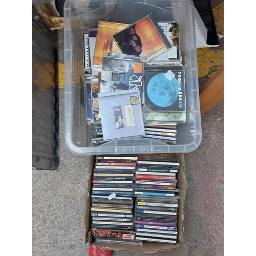 440 - Two boxes containing a large collection of CD's including various artists such as U2, The Doors, REM... 