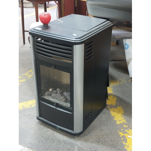 452 - Star Lot : A high quality portable gas heater with log effect detail. Includes a  11kg bottle of Flo... 