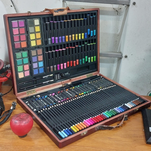 456 - A large artist box containing a large quantity of oil pastel coloring pencils, crayons, pens as well... 