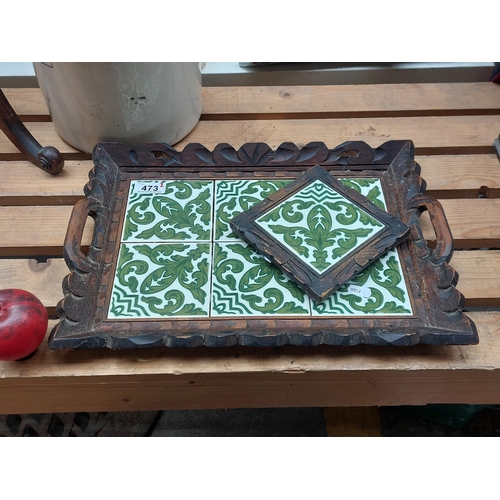 473 - A lovely carved wooden tea tray and matching Trivet boasting green and white art pottery glazed tile... 