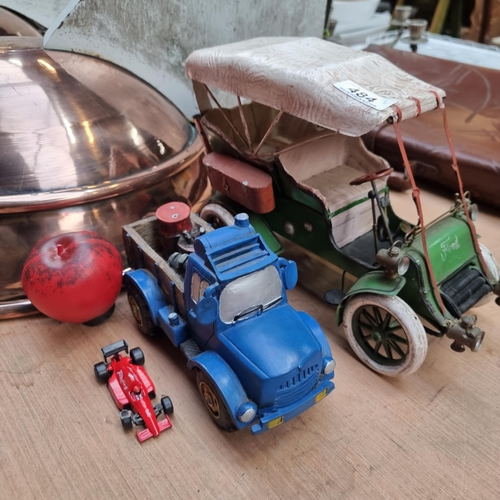 484 - A fantastic large model of the ford Model T car in a green finish, along with a sculpture of a picku... 