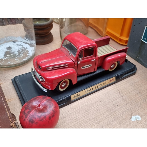 486 - A large super diecast  Snap-on Ford 1948 F-1 Pickup Truck in a glossy red finish. Held on a plinth w... 