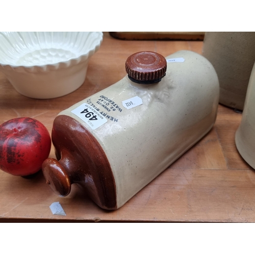 494 - A stoneware hot water bottle reading Henry Bell Ltd. Chemists 62 Quay Waterford. In very good condit... 