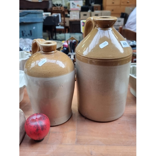 496 - Two antique two-tone stoneware whiskey crock including a 1 gallon and 2 gallon. In good order with h... 