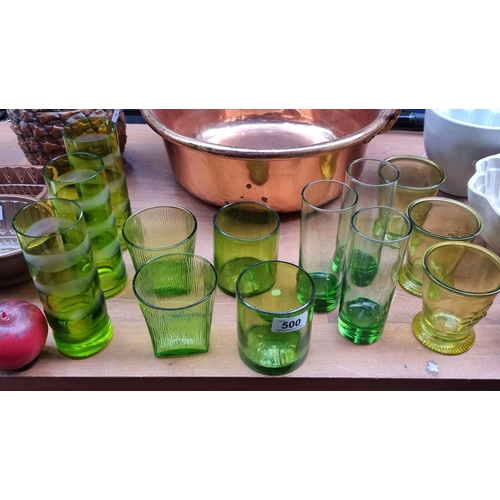 500 - A collection of thirteen vintage lime green glasses some with pontil marks to base. Includes Uranium... 