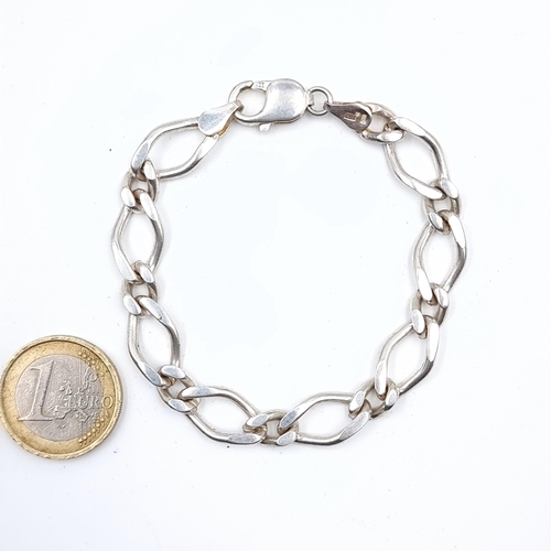 517 - A sterling silver chain link bracelet, weight 23.46 grams, boxed.