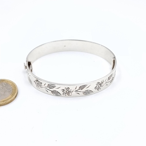 519 - A sterling silver hallmarked sheffield bracelet set with floral design, weight 24.64 grams, boxed