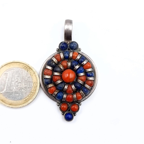 534 - A vintage very unusual coral and lapis lazuli pendant set in sterling silver, dimensions 5cmx3cm, we... 