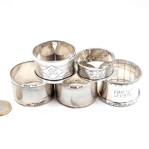 543 - A collection of five sterling silver napkin rings with various hallmarks total weight 89 grams.