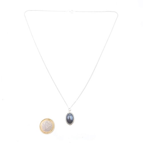 550 - An agate stone pendant with sterling silver chain, length of chain 56cm.