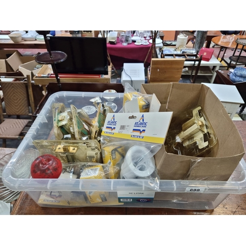 699 - A Large plastic crate containing a large assortment of brass door handles and locks. New old Stock S... 